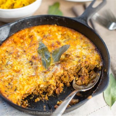  Bobotie! Una deliziosa torta salata sudafricana che combina spezie aromatiche e una ricca crema all'uovo